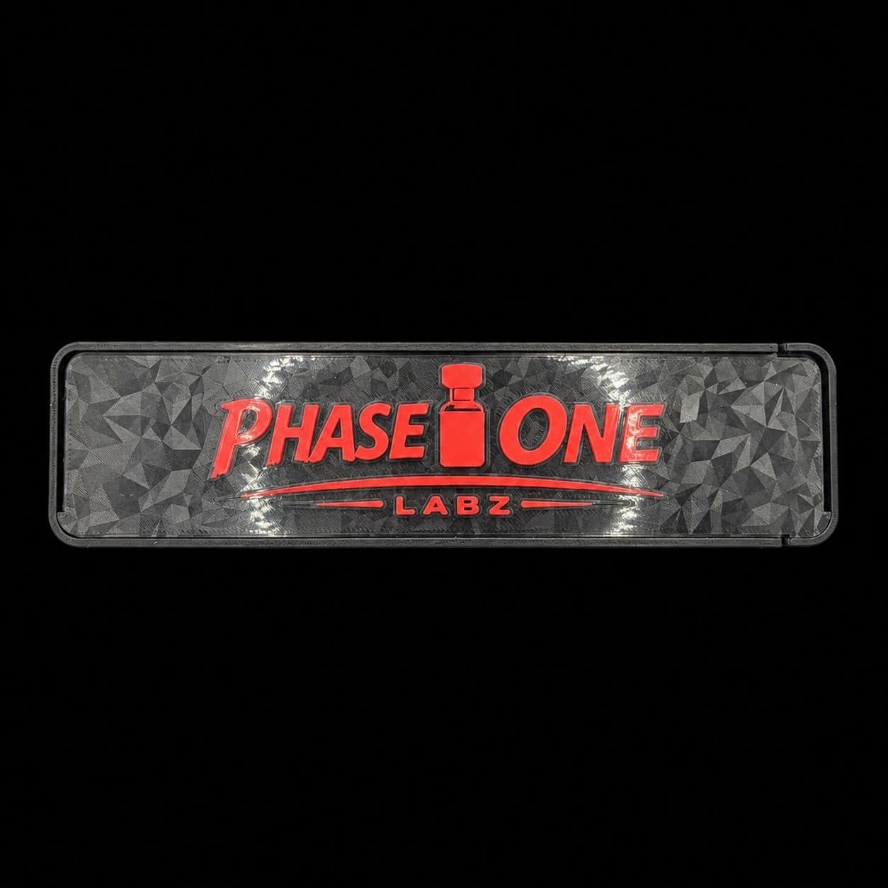 Phase One Labz logo on a black background, featuring red and gray text and design elements.